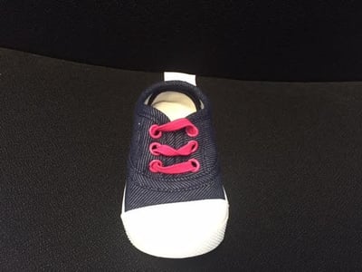 Skidders Footwear denim colored fabric with pink rivets and laces